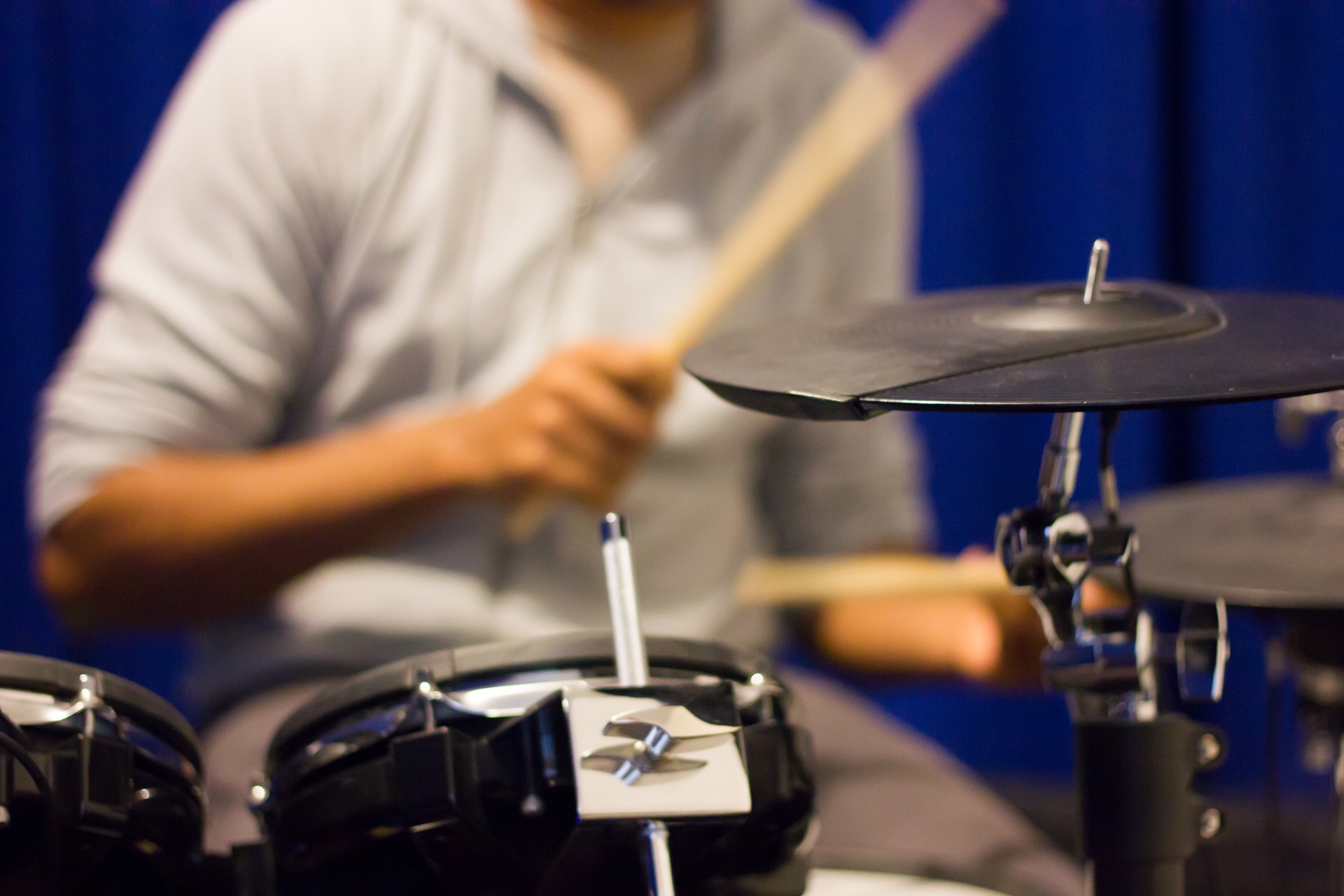 Drummer practising on rubber cymbals