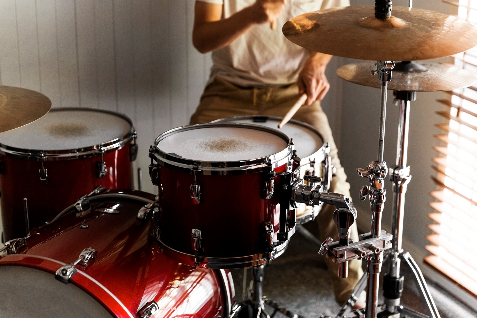 Drummer Practicing Rudiments On His Home Drum Kit